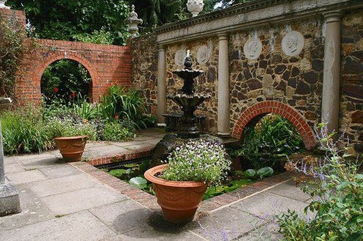 Renaissance style garden decor, tiered fountain, column, wall plaque, wall decor, pots, planter, urn